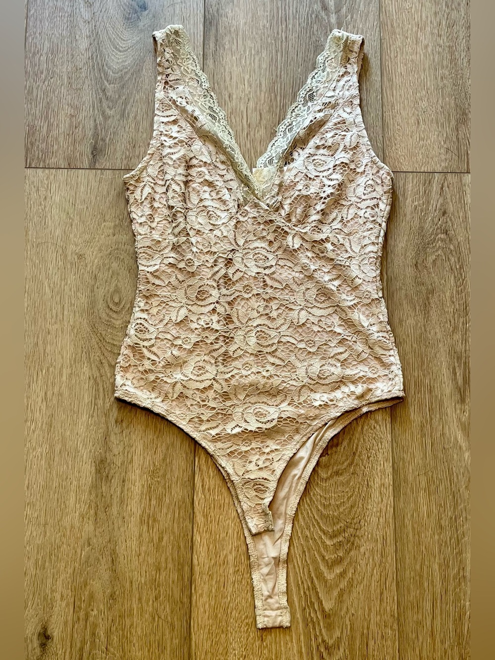 Elodie from Nordstrom Rack Lace V-Neck Thong Bodysuit in Beige